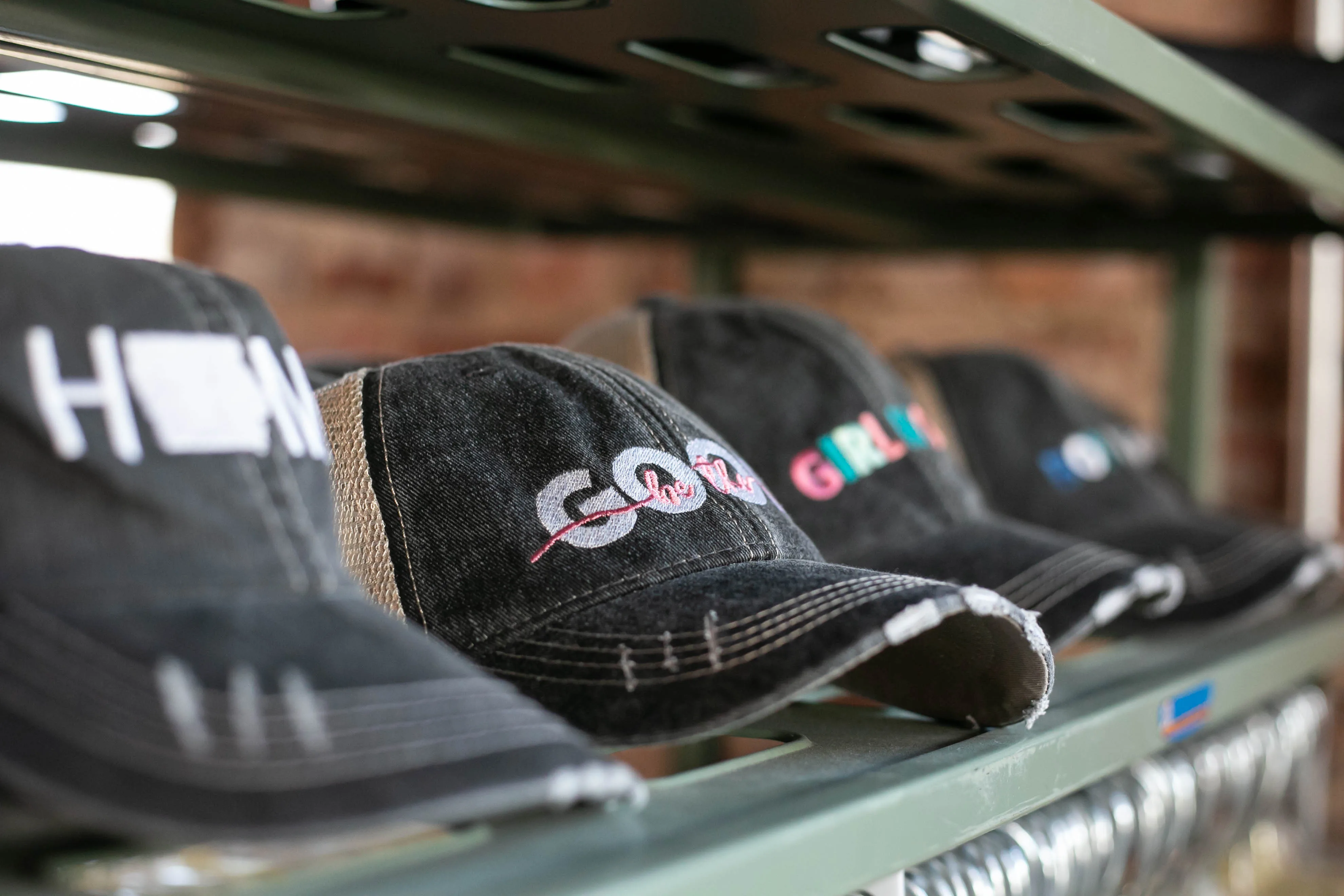 Embroidered caps on display
