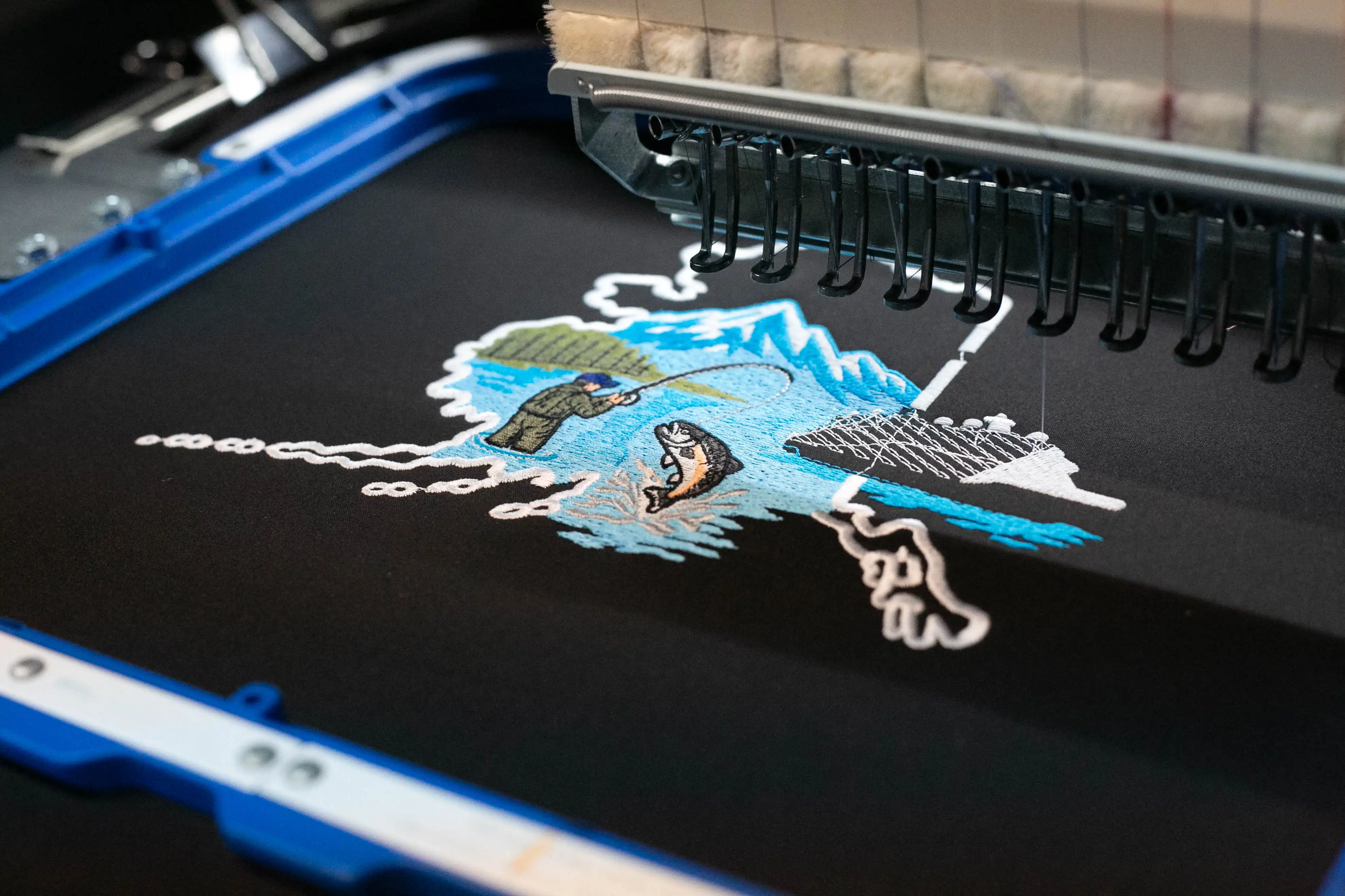 Flat display of embroidered garments for business